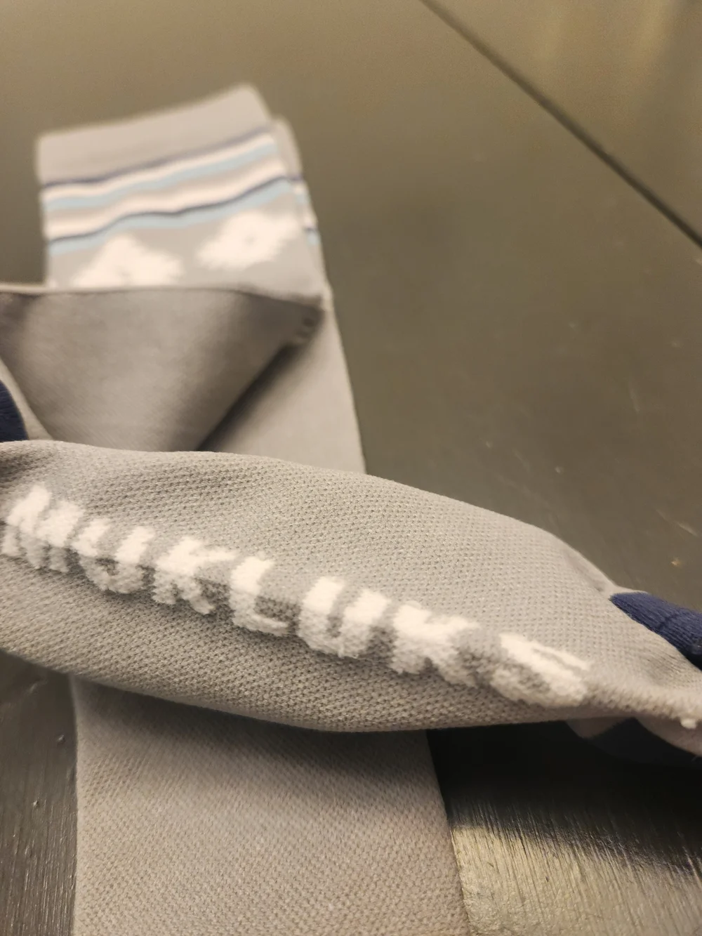 Muk Luks Gray Knee-High Socks with Navy Accents and Light Blue Stripes